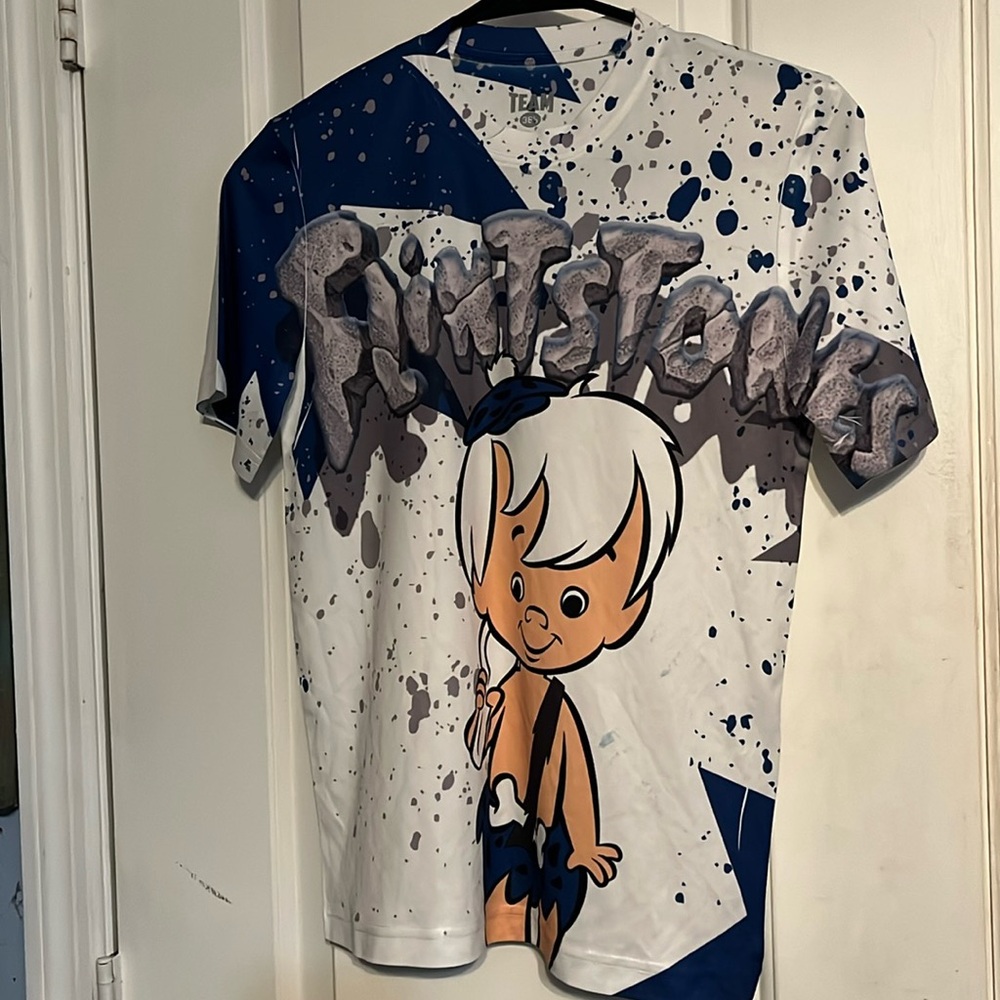 Flintstones BamBam youth shirt, size medium 10/12. Has a few blue splotches.